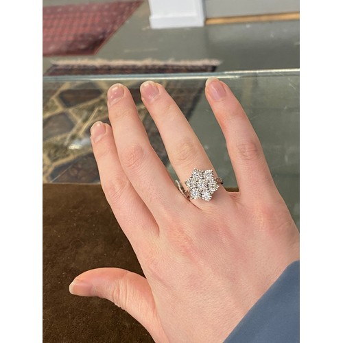 22 - A heavy 18ct white gold and diamond floral cluster ring, the diamonds each 3mmD and totalling approx... 
