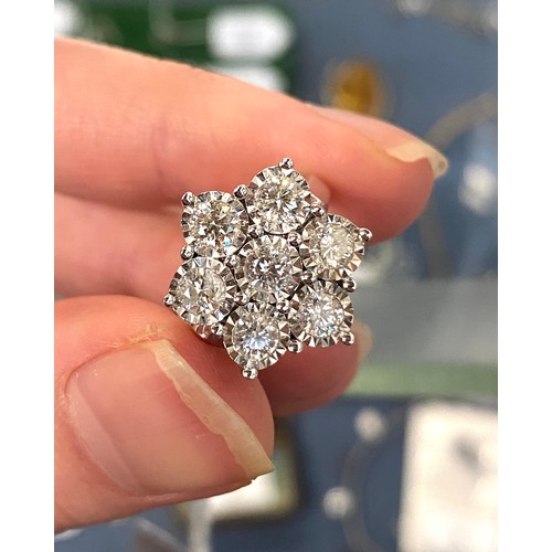 22 - A heavy 18ct white gold and diamond floral cluster ring, the diamonds each 3mmD and totalling approx... 