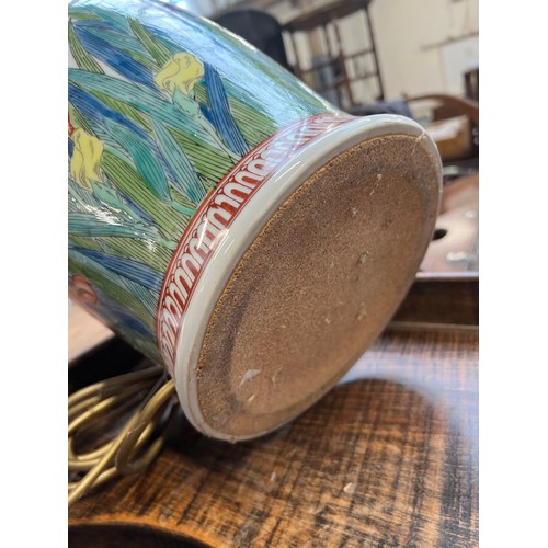 1084 - A large ceramic table lamp decorated with irises, 40cmH to base of fitting