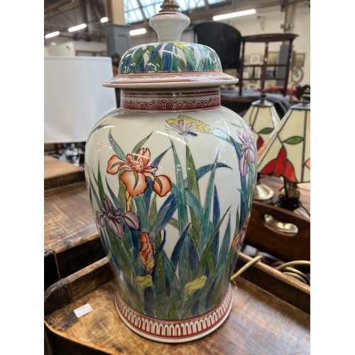 1084 - A large ceramic table lamp decorated with irises, 40cmH to base of fitting