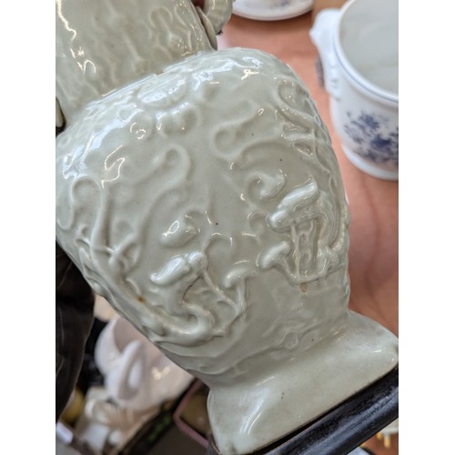 160 - A Chinese twin handled celadon glazed vase converted for use as a table lamp, with twin dragon lug h... 