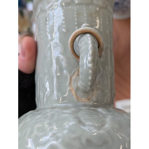 160 - A Chinese twin handled celadon glazed vase converted for use as a table lamp, with twin dragon lug h... 