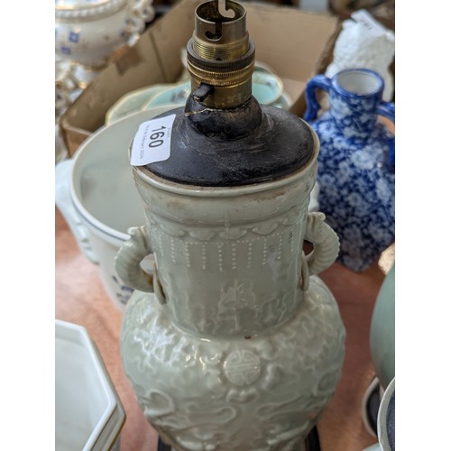160 - A Chinese twin handled celadon glazed vase converted for use as a table lamp, with twin dragon lug h... 