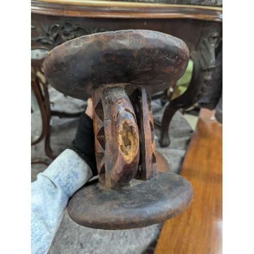 1149 - Two carved African tribal stools, possibly Tonga tribe, 23cmH and 26.5cmH