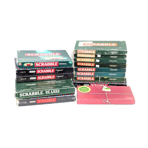 299 - A collection of vintage Scrabble games to include: Deluxe (2), Original (4), New Edition (1)