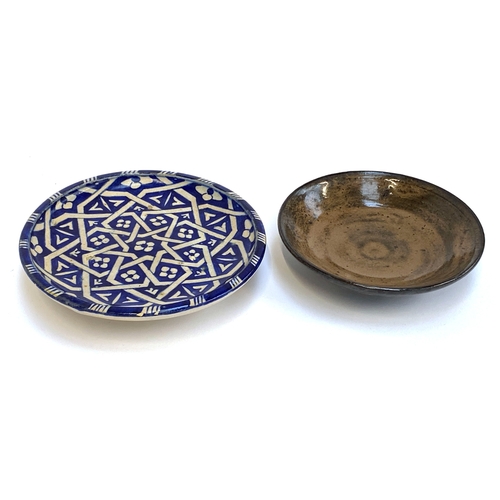 245 - A Moroccan blue and white earthenware footed dish, signed to base, 18cmD; together with a further br... 