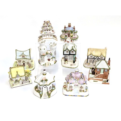 244 - A quantity of Coalport model houses to include: 'The Crooked House', 'The Fishermans Cottage', 'Keep... 