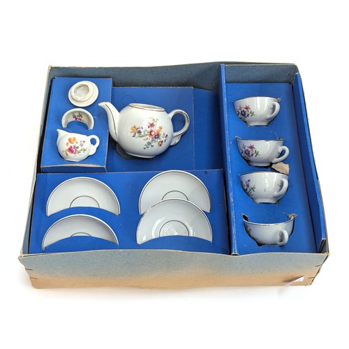 263 - A boxed 'Codeg' child's tea set, with settings for four