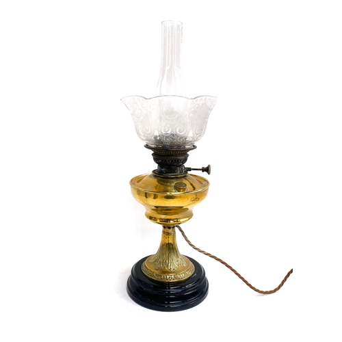 301 - A Victorian brass oil lamp with etched glass shade and chimney, converted for electricity; 58cmH to ... 