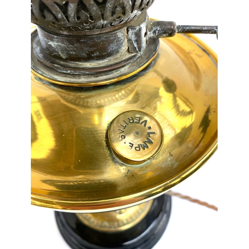 301 - A Victorian brass oil lamp with etched glass shade and chimney, converted for electricity; 58cmH to ... 