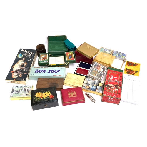 303 - A good collection of vintage playing cards and games etc