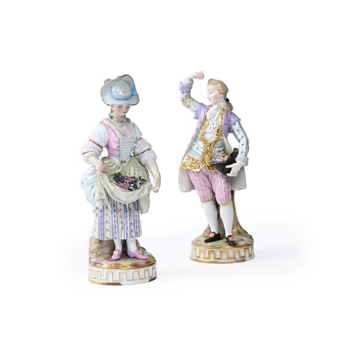 274 - A pair of 19th century Meissen figures of a gallant and companion (af), the lady holding flowers in ... 