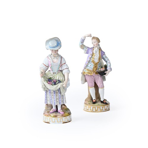 274 - A pair of 19th century Meissen figures of a gallant and companion (af), the lady holding flowers in ... 