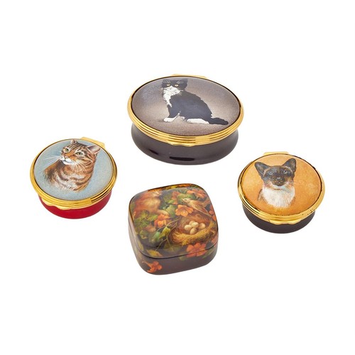 251 - Three Halcyon Days enamel pill boxes, the lids decorated with cats; together with a lacquer box (4)
