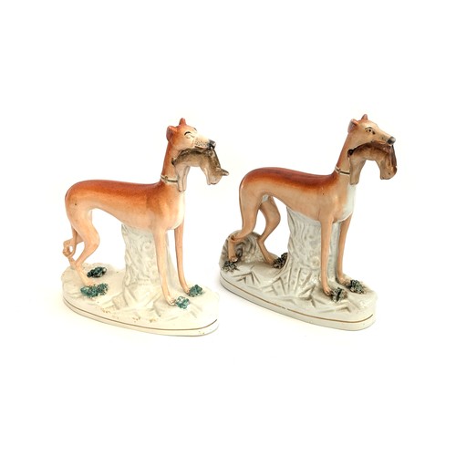 290 - A pair of 19th century Staffordshire long dog figures with quarry, 28.5cmH