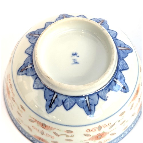 286 - An early 20th century Chinese blue and white bowl, together with a rice bowl and spoon, marked to ba... 