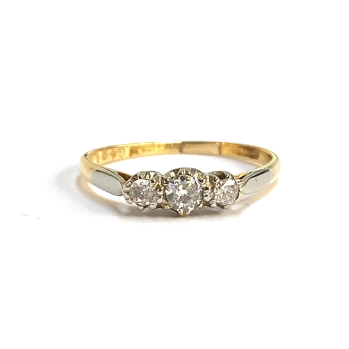 53 - An 18ct gold and diamond trilogy ring, the central diamond 3mmD, size P, 2.1g