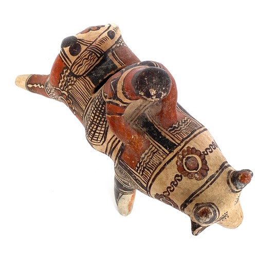 276 - A Mexican folk art terracotta figure of bull and rider, 22cmH