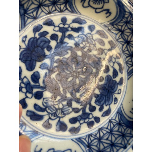 286 - An early 20th century Chinese blue and white bowl, together with a rice bowl and spoon, marked to ba... 