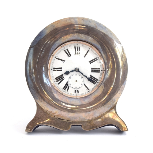38 - A plated Goliath pocket watch, 6.2cm diameter, with a silver case, c.1900, 12cm high