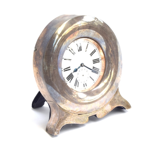 38 - A plated Goliath pocket watch, 6.2cm diameter, with a silver case, c.1900, 12cm high