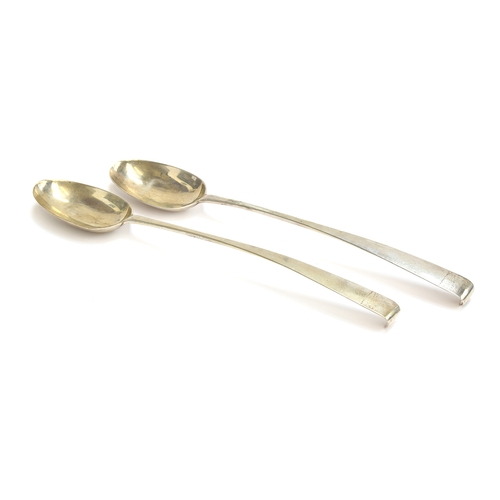 49 - A pair of Irish silver serving spoons, maker's mark IC, Dublin 1775, with crested hooked terminals, ... 
