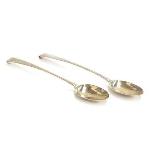 49 - A pair of Irish silver serving spoons, maker's mark IC, Dublin 1775, with crested hooked terminals, ... 