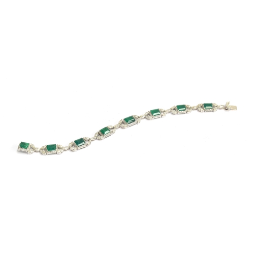 27 - An 18ct white gold emerald and diamond bracelet, the eight large emeralds approx. totalling 12.15 ca... 