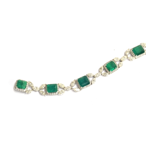 27 - An 18ct white gold emerald and diamond bracelet, the eight large emeralds approx. totalling 12.15 ca... 