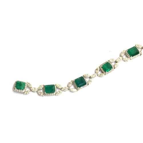 27 - An 18ct white gold emerald and diamond bracelet, the eight large emeralds approx. totalling 12.15 ca... 