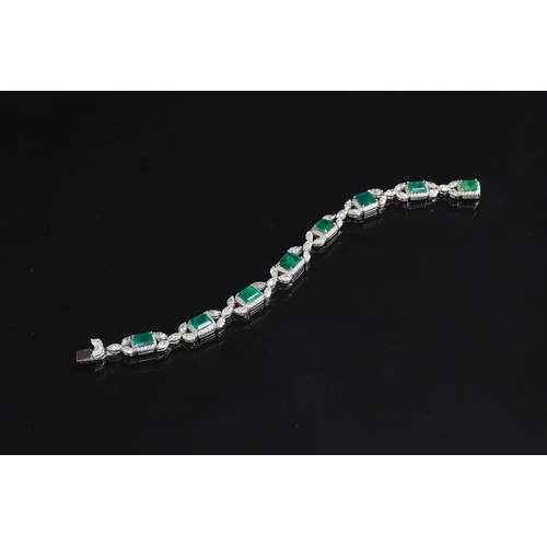 27 - An 18ct white gold emerald and diamond bracelet, the eight large emeralds approx. totalling 12.15 ca... 