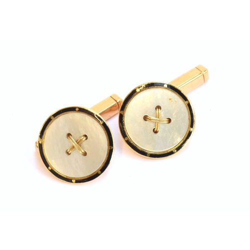 10 - A pair of Art Deco 18ct gold, mother of pearl and black enamel button form cufflinks, 1.4cm diameter... 
