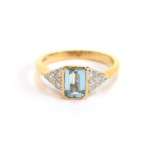 7 - An 18ct gold, aquamarine and diamond ring, the emerald cut aquamarine approx. 0.63ct, flanked by thr... 
