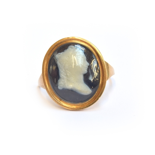 1 - A Georgian gold mounted cameo ring, the glass cameo depicting a woman in profile facing right, glaze... 