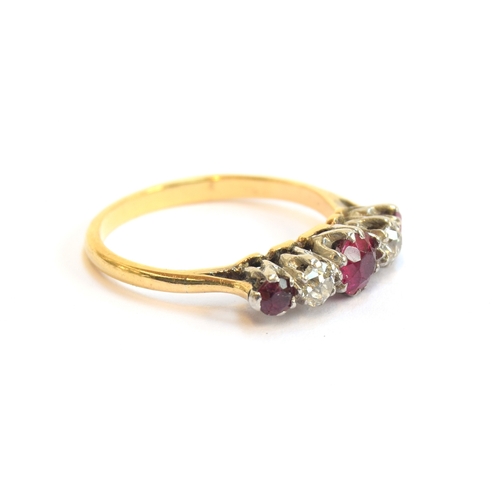 6 - An early 20th century 18ct gold, ruby and diamond five stone ring, the largest ruby 4.5mm diameter, ... 