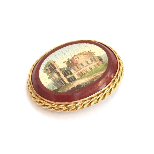 20 - A Victorian Grand Tour gold mounted double sided micromosaic brooch depicting ruins within a red bor... 