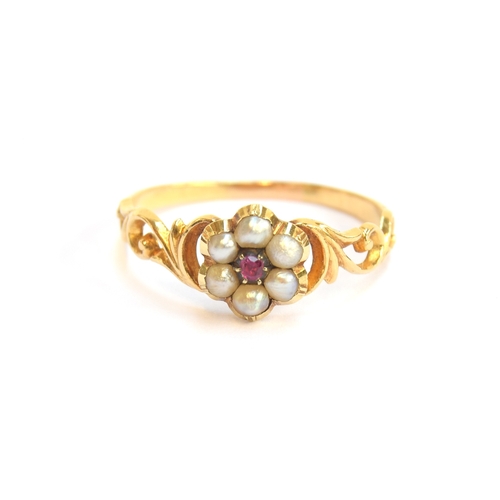 3 - An early Victorian gold, ruby and split pearl floral cluster ring with pierced foliate shoulders, si... 