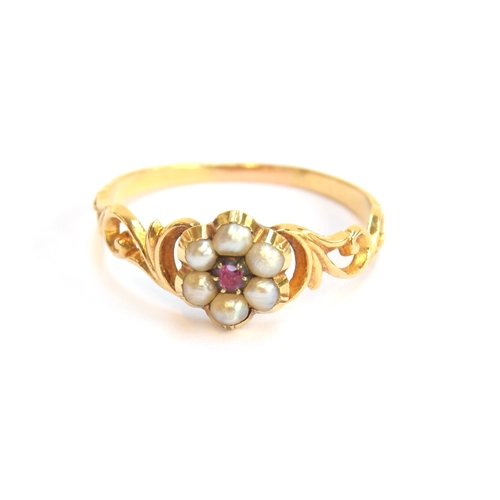 3 - An early Victorian gold, ruby and split pearl floral cluster ring with pierced foliate shoulders, si... 