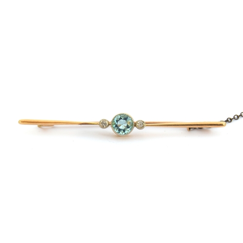 16 - An Art Deco diamond and blue zircon bar brooch, the zircon 6mm diameter, with milgrain detail bezel ... 