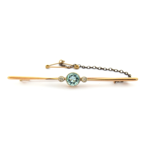 16 - An Art Deco diamond and blue zircon bar brooch, the zircon 6mm diameter, with milgrain detail bezel ... 