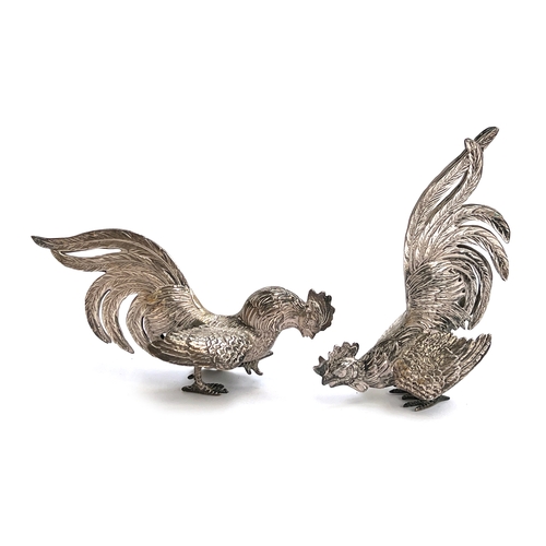 A pair of 925 silver cockerels, each with silver import marks, 9cm and 14cm high respectively, 249g