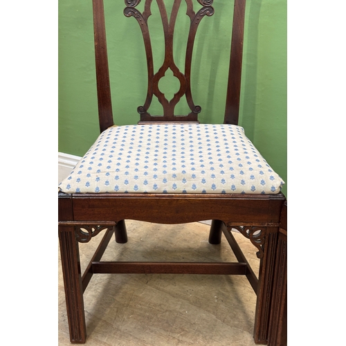 A pair of George III Chippendale style mahogany side chairs with ...
