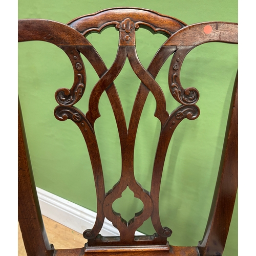A pair of George III Chippendale style mahogany side chairs with ...