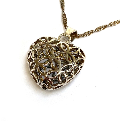27 - A 925 silver heart pendant of pierced form, 2cmW, on a 925 silver chain, the chain 43cmL unclasped, ... 