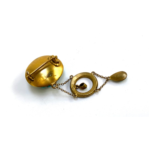 29 - An Edwardian 900 silver gilt brooch pave set with turquoise cabochons, 2.3cmW, 6cmL, 12.1g