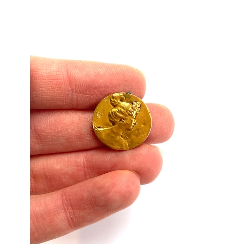 30 - A French Art Nouveau gold medallion/jewellery element depicting a lady in profile, monogrammed TW, l... 