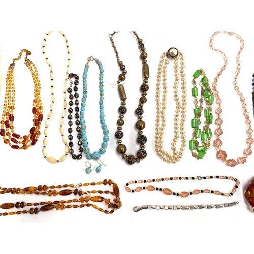 51 - A group of vintage beaded necklaces, one with 9ct gold barrel clasp, to include Venetian glass beads... 
