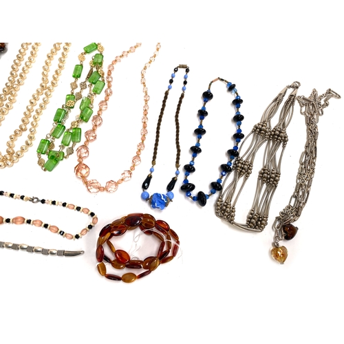 51 - A group of vintage beaded necklaces, one with 9ct gold barrel clasp, to include Venetian glass beads... 