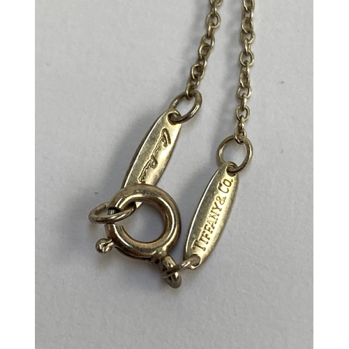 56 - A Tiffany & Co. Elsa Peretti 925 silver apple pendant on original chain, the pendant 1.5cmW