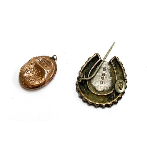 6 - A 9ct gold back and front locket, 2.4g gross weight; together with a silver aesthetic movement brooc... 